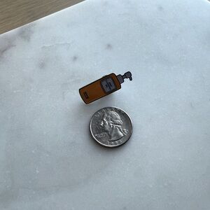 DHC Enamel Pin